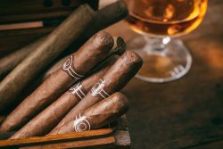 Cuban,Cigars,In,A,Wooden,Box,,Blur,Glass,Of,Cognac