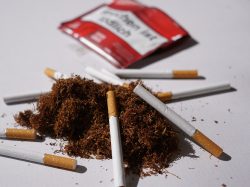 Heap,Of,Herbal,Smoking,Tobacco,And,Cigarettes,On,White,Background