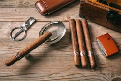 Cuban,Cigars,And,Smoking,Accessories,On,Wooden,Background,,Top,View